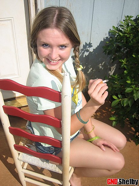 Young teenie bitch gf woman smokes a cigarette while exposing her melons and pussy - Image 7 of 12  in Outdoor category  