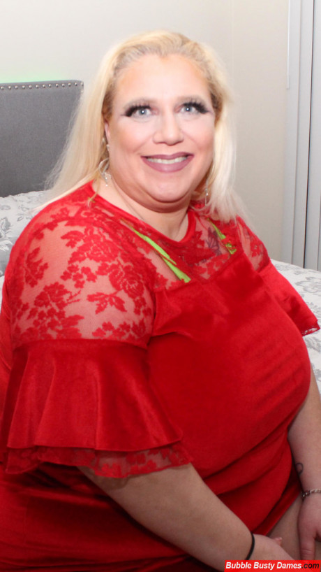 Obese blondie amateur shows her large butt on a bed in a v-shape bikini - #1090539