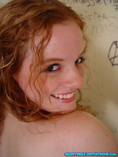 Ginger Head teen Roxana strips, masturbates and swallows a yummy gloryhole dong