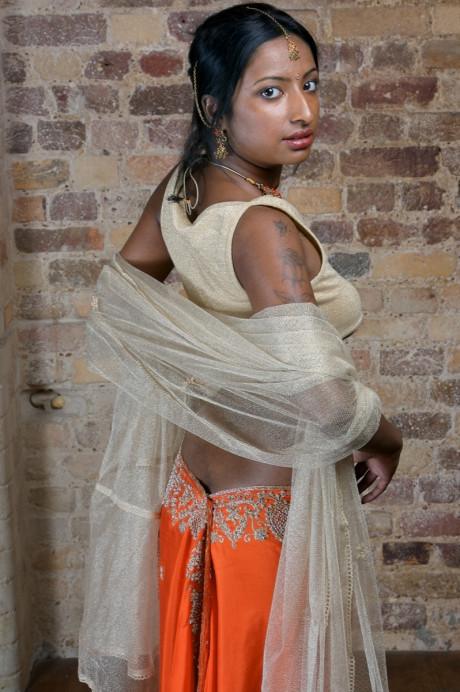 Indian model with tattoos exposes her firm breasts in traditional clothing - #663042