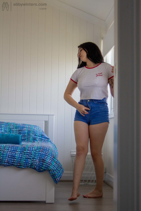 Hot dark haired amateur Mikayla teases with her round butt while dressing