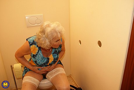 Blondy old lady Maria rubs her bush while blowing a gloryhole dong in nylons - Image 3 of 20  in Cumshot category   featuring Norma 