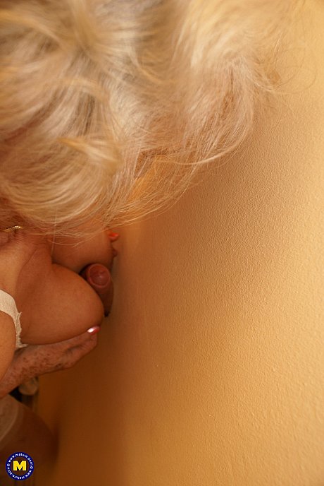 Blondy old lady Maria rubs her bush while blowing a gloryhole dong in nylons - Image 11 of 20  in Cumshot category   featuring Norma 
