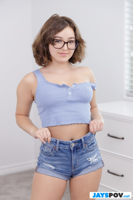 Nerd Leana Lovings poses in her attractive denim shorts and unveils her boobies - #1108103