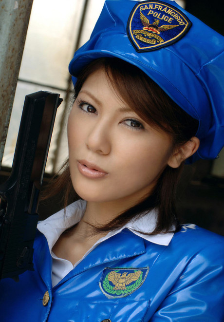 Oriental policewoman Anna wields a pistol in a short latex skirt and pantyhose - #554166