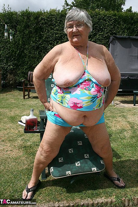 Kinky amateur grandmother Libby inserting a bottle in her meaty vagina in the garden - Image 7 of 20  in Outdoor category   featuring Grandma Libby 