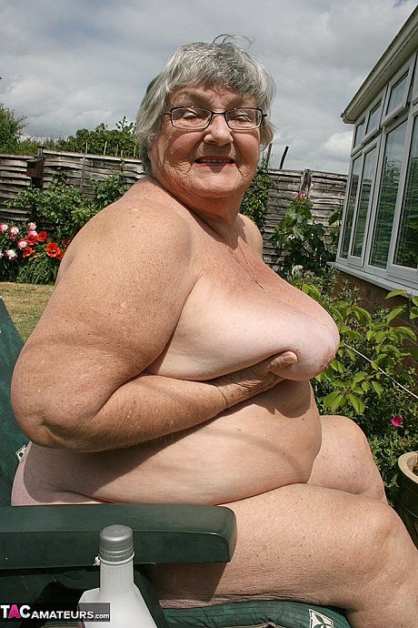 Kinky amateur grandmother Libby inserting a bottle in her meaty vagina in the garden - Image 10 of 20  in Outdoor category   featuring Grandma Libby 