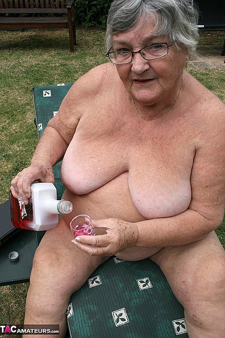 Kinky amateur grandmother Libby inserting a bottle in her meaty vagina in the garden - Image 17 of 20  in Outdoor category   featuring Grandma Libby 