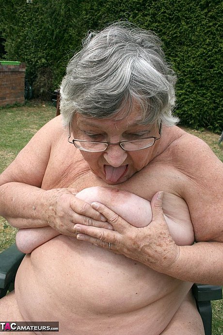 Kinky amateur grandmother Libby inserting a bottle in her meaty vagina in the garden - Image 18 of 20  in Outdoor category   featuring Grandma Libby 