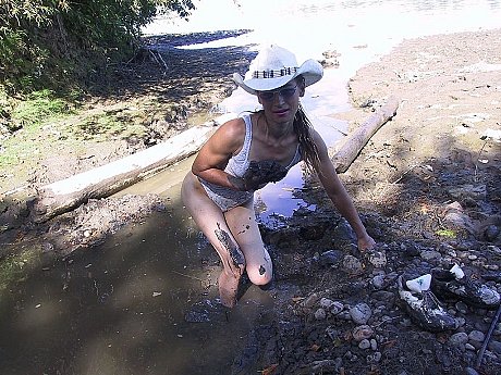 Cowgirl Erika Shelley exposes her tiny breasts while playing in the mud - Image 6 of 21  in Outdoor category   featuring Erika Shelley 
