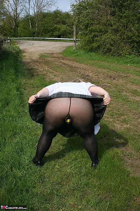 Meaty British woman Lexie Cummings exposes herself in a field while wearing hose - Image 11 of 16  in Pussy category   featuring Lexie Cummings 