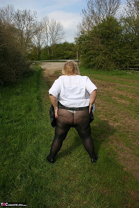 Meaty British woman Lexie Cummings exposes herself in a field while wearing hose - Image 14 of 16  in Pussy category   featuring Lexie Cummings 