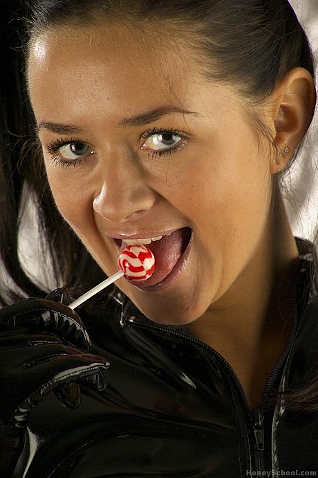 Pretty teenie with pigtails removes latex clothing to go nude in mesh nylons - Image 2 of 15  in Close Up category  