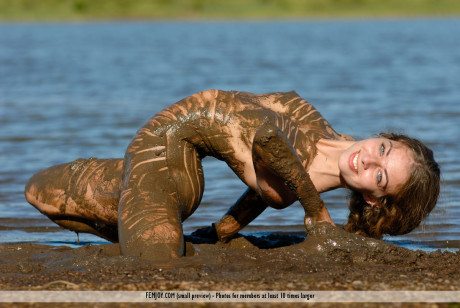 Pretty sweet lady girlfriend chick Katelin covers her flexible body in mud while at a lake - #982097
