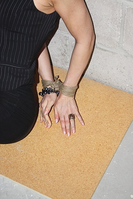 Bound and gagged MILF Eve struggles to free herself on the basement floor - Image 5 of 21  in Legs category   featuring Eve 