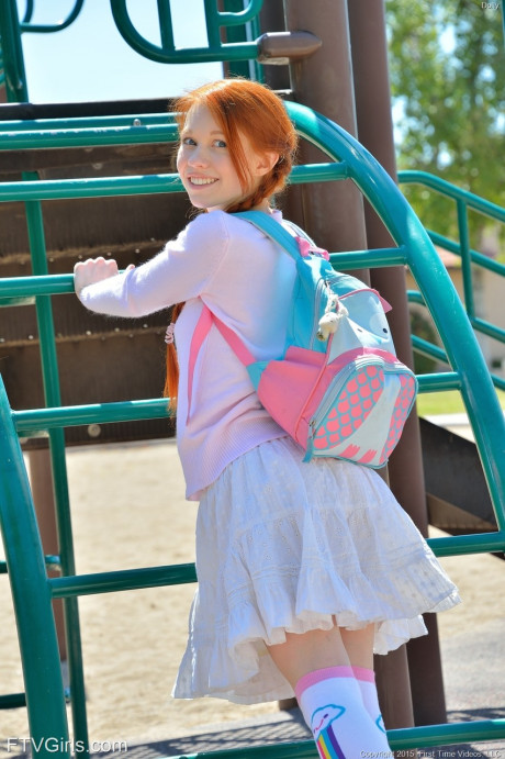 Short redheaded schoolgirl Dolly giving a pantyless upskirt in public - #32109