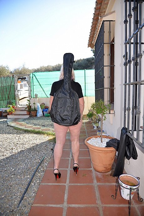 Cougar blonde Melody shows her gigantic breasts and behind on a patio - Image 16 of 16  in Outdoor category   featuring Melody 