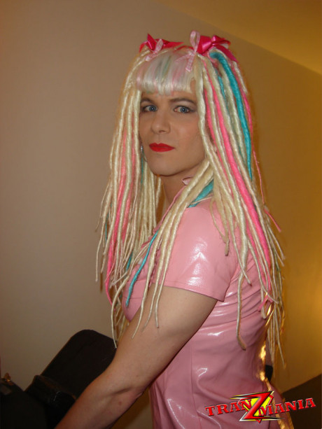 Naughty crazy haired crossdresser wearing pink pvc gets ready to go on the - #775965