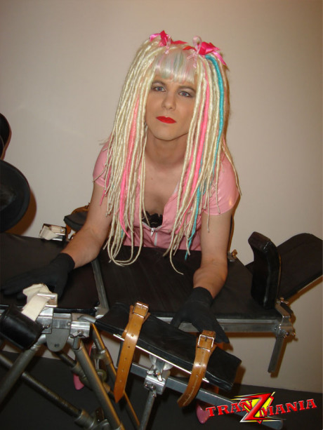 Naughty crazy haired crossdresser wearing pink pvc gets ready to go on the - #775966