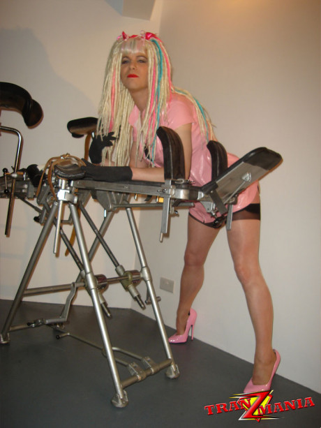 Naughty crazy haired crossdresser wearing pink pvc gets ready to go on the - #775968