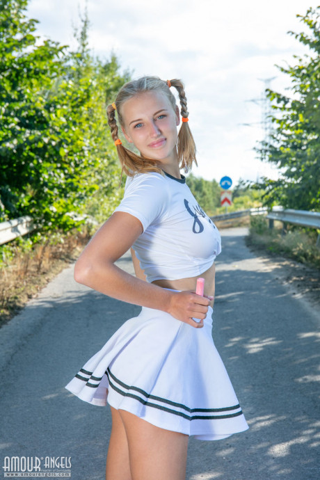 Blonde teenie Nana strips to her socks and runners on a paved road - #346057