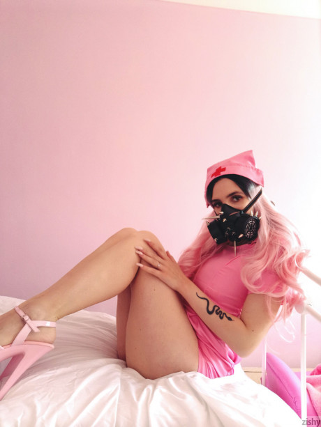 Sleazy Quarantine Challenge sheds her nurse costume & poses in a gas mask