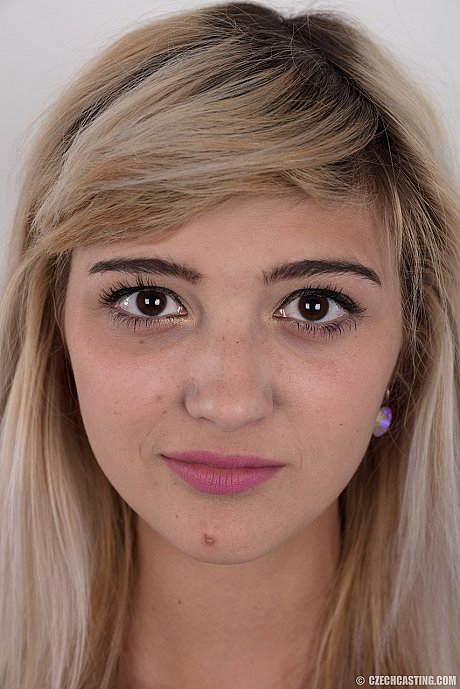 Young Karolina hopes to break into porn by peeling her short skirt to pose naked