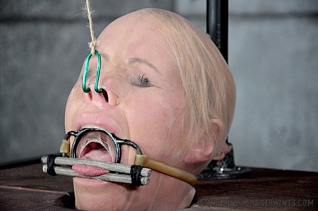 Blondie female Simone Sonay is rendered helpless in a basement vault