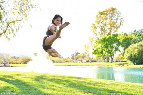 Teenage cutie in sexy outfit Zoe doing exercise outdoors by the water - #650829