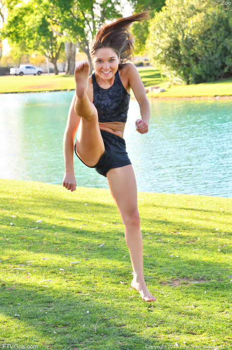 Teenage cutie in sexy outfit Zoe doing exercise outdoors by the water - #650834