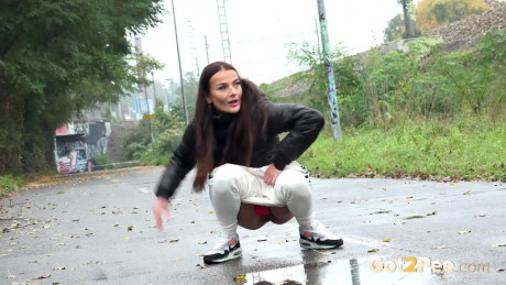 Maddi black relieves herself next to train track - #901020