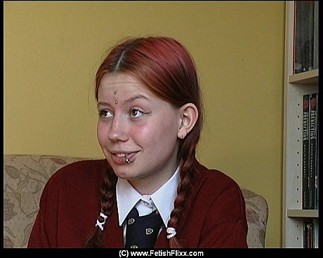 Redheaded student has her bareback bottom turned pink during a caning session - Image 2 of 12  in Teen category  