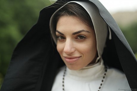 Sinful nun Darcie Dolce flashes her humongous breasts outdoors and rubs her cunt - Image 2 of 18  in Pussy category   featuring Darcie Dolce 