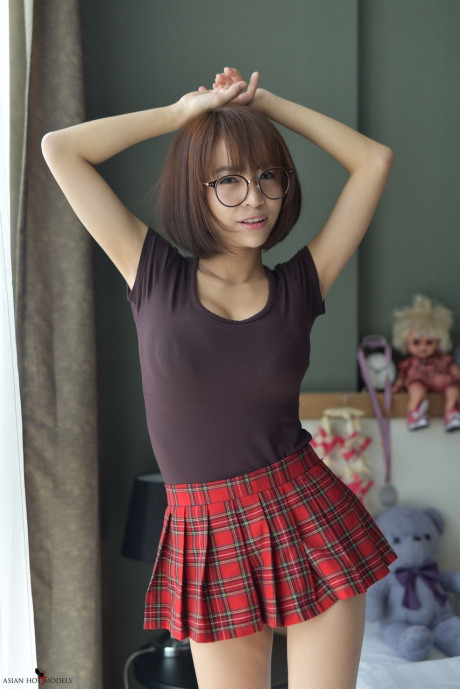 Pretty attractive chinese young flaunts her hot behind wearing a miniskirt and panties - #817383