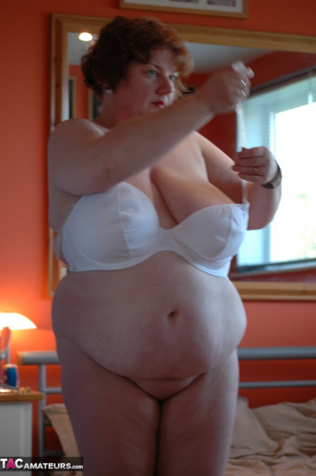 Wide amateur uncups her gigantic tits as she steps inside to change clothes - #1223846