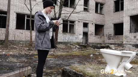 Short taken lady girl chick Alexa pisses atop a toilet outside of an abandoned building - #1332256