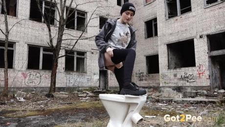 Short taken lady girl chick Alexa pisses atop a toilet outside of an abandoned building - #1332258