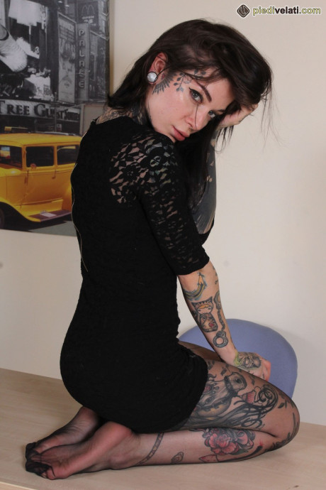 Tattooed skank girlfriend lady Refen removes her red soled heels while wearing stockings - #176502