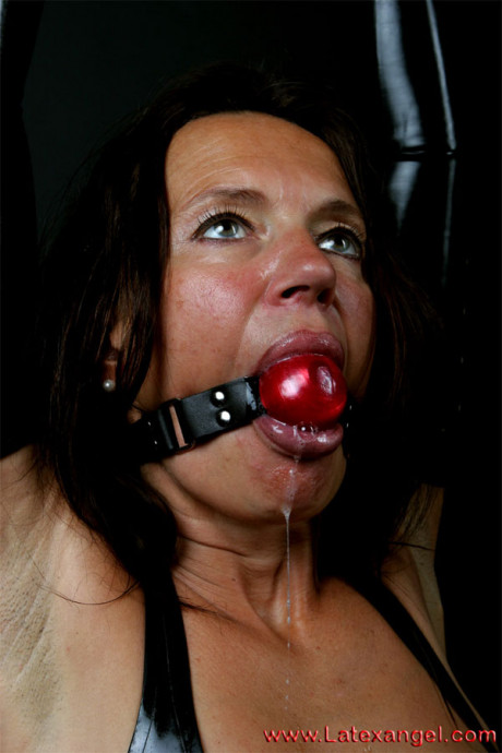 Restrained brunette drools while ball gagged and popping out anal beads - #674084