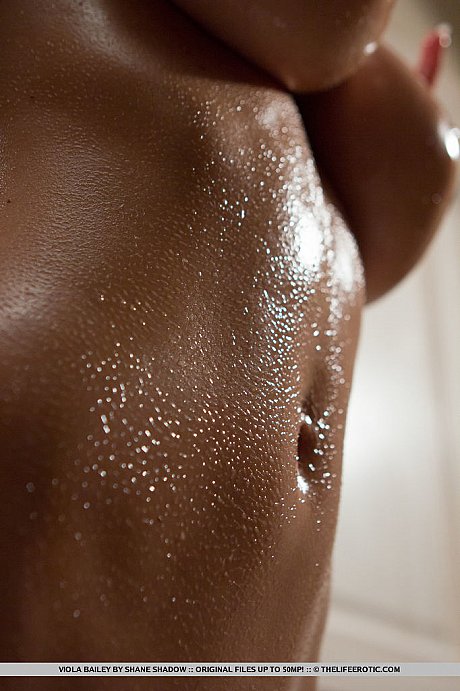 Busty blondy Viola Bailey oils up her giant melons and fingers her horny twat