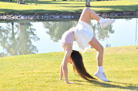 Brunette amateur Dakota does a cartwheel in a park before getting nude - #416592