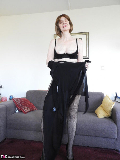 Redheaded grandmother Kat Kitty gets unprotected undressed before inserting a sex toy - #1193262