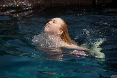 Undressed babe Samantha Rone stretching and showing her boobs in the pool