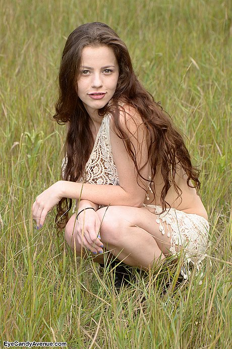 Thin young teenie chick girl girl Iva Nora teases her long hair in a field - Image 16 of 16  in Outdoor category   featuring Iva Nora 