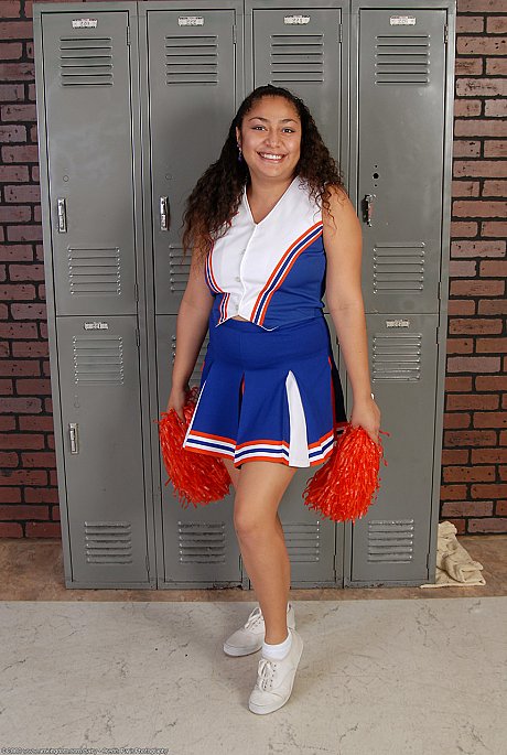 Skinny curly haired cheerleader Reena shows her wide ass and furry snatch - Image 1 of 20  in Latina category   featuring Reena 