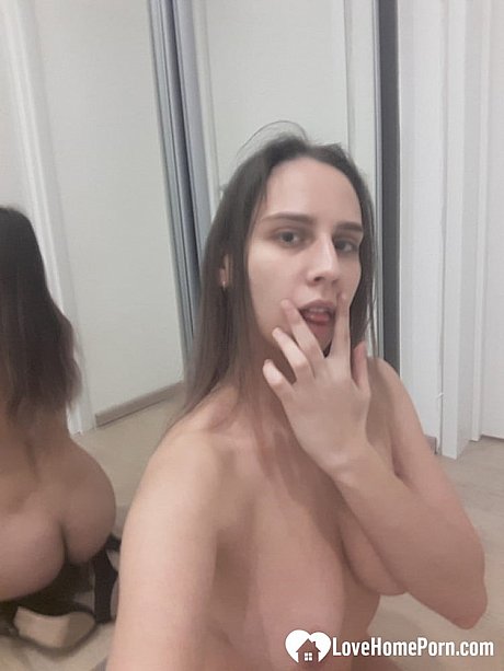 Dirty amateur babe poses nude in the mirror and shows her juicy titties - Image 16 of 20  in Babe category  