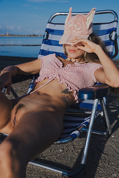 Nice young Irene Rouse shows her twat on a lawn rocker while at the beach - Image 16 of 21  in Babe category   featuring Irene Rouse 