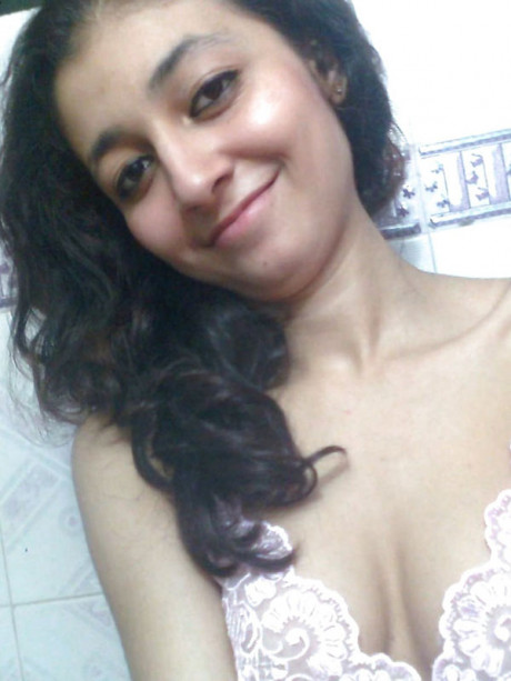 Indian solo girl girl girl holds her face firm while letting nipples free of underwear