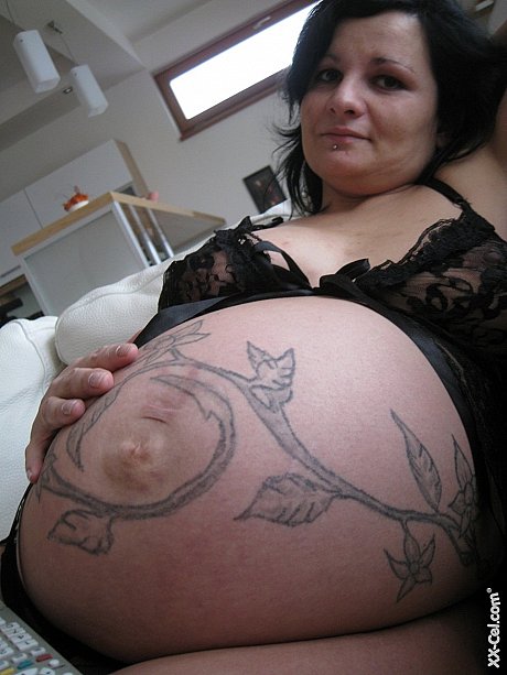 Pregnant amateur Pavlina exposes her humongous boobs and nipples and poses on a bed - Image 2 of 21  in Pussy category   featuring Pavlina 