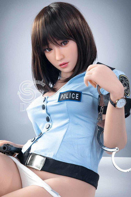 Beautiful oriental sex doll shows her pretty titties in a police uniform - #981045